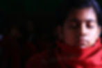 Nepali girl meditating with her eyes closed