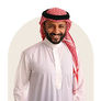 Smiling man wearing a white thobe and red ghutra