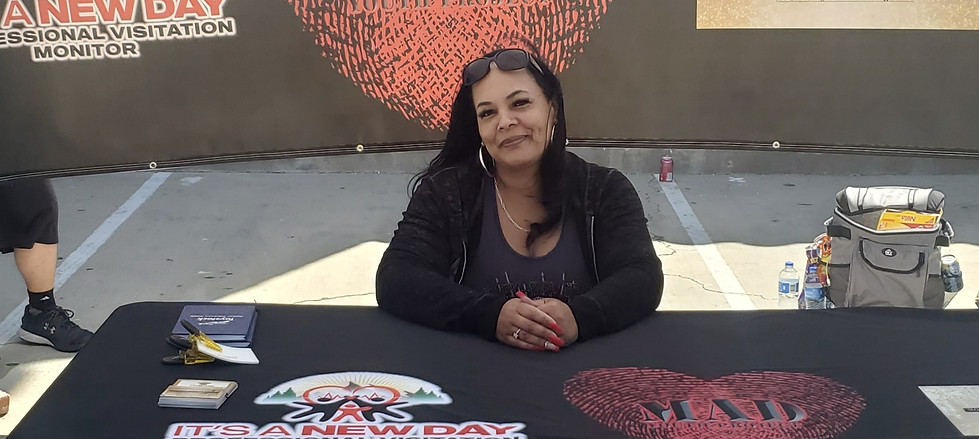 Andreana Thomas, the owner, sitting at a table