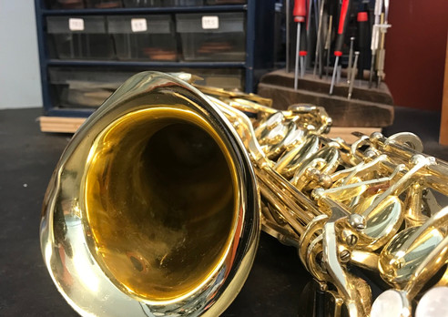 A severly crushed sax bell