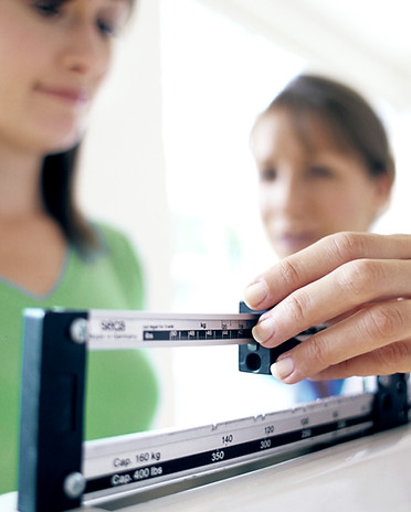 Woman checking weight