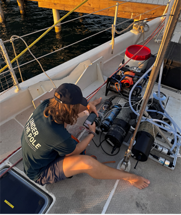 Melina Sinner, PhD candidate at Sorbonne University, calibrates the COMET prior to deployment.