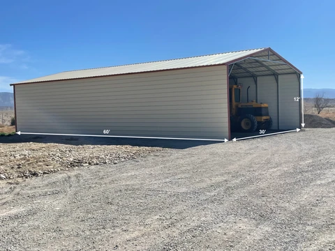Long metal building with an open end bay