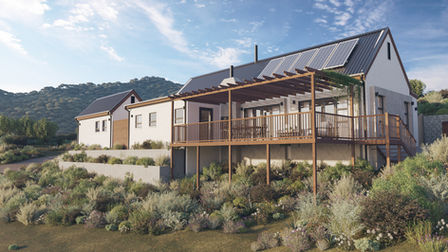 Photorealistic 3D rendering of a contemporary sustainable residence in Knysna, South Africa, featuring pitched roofs with solar panels, a timber pergola and elevated deck, natural landscaping, and mountain views, designed by Arcvisa Studio.