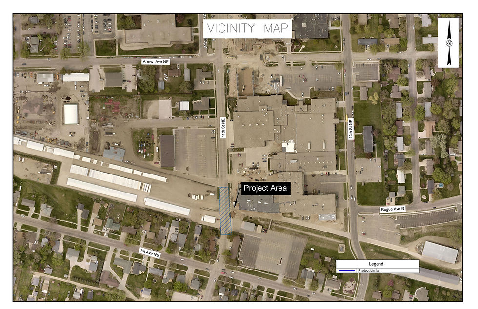 Aerial vicinity map labeled Project Area with streets, buildings, parking lots, and blue hatched project limits in a neighborhood.