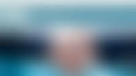 Handshake with suited arms in focus, featuring the South Dakota Governor's Office of Economic Development text and state seal, calm mood.