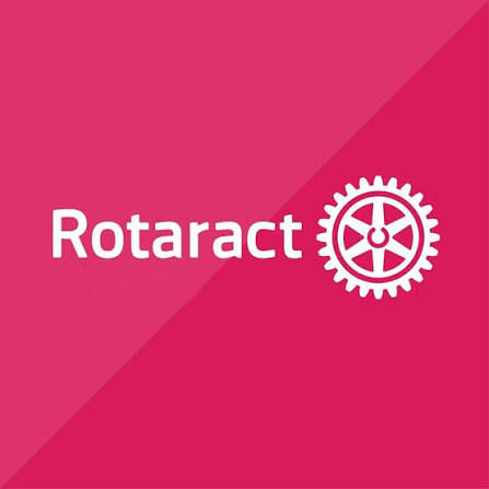 Pink background with white Rotaract text and gear logo centered, simple branded graphic.