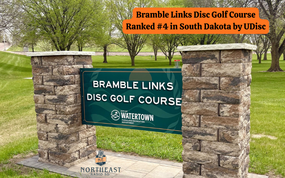 Sign for Bramble Links Disc Golf Course, ranked #4 in South Dakota by UDisc. Set in a grassy park with trees and stone pillars.