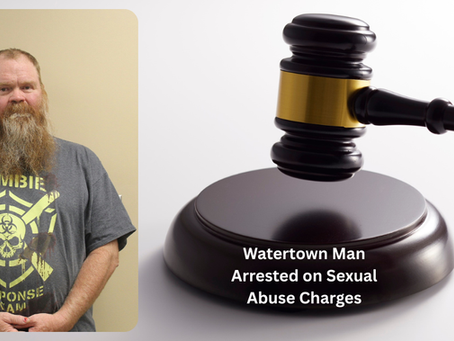 Man with beard in gray "Zombie Response" shirt stands against height chart; right, a gavel and text: "Watertown Man Arrested on Sexual Abuse Charges."