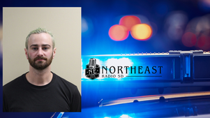 Mugshot of a man inset over flashing police lights and Northeast Radio SD logo, creating a tense news-style graphic.