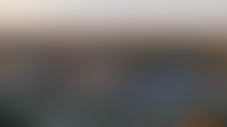 Aerial view of Sanford Health building at sunset, with parking lot and green landscape. Logos for Sanford Health and Northeast Radio SD.