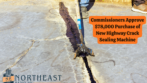 A worker seals a highway crack with a machine. Text: "Commissioners Approve $78,000 Purchase of New Highway Crack Sealing Machine." Sunny setting.