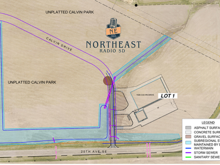 Site plan map for Northeast Radio SD showing Lot 1 at Calvin Drive and 20th Ave SE, with colored utility lines and unplatted Calvin Park.