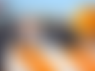 Roadwork zone with orange-striped barriers and flashing lights. "SD Department of Transportation" logo in corner. Sunny day, clear road.