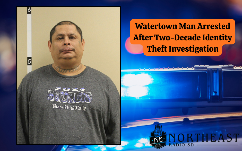 Man in gray "Sturgis" shirt poses for a mugshot; text reads "Watertown Man Arrested After Two-Decade Identity Theft Investigation." Blue police lights in the background.