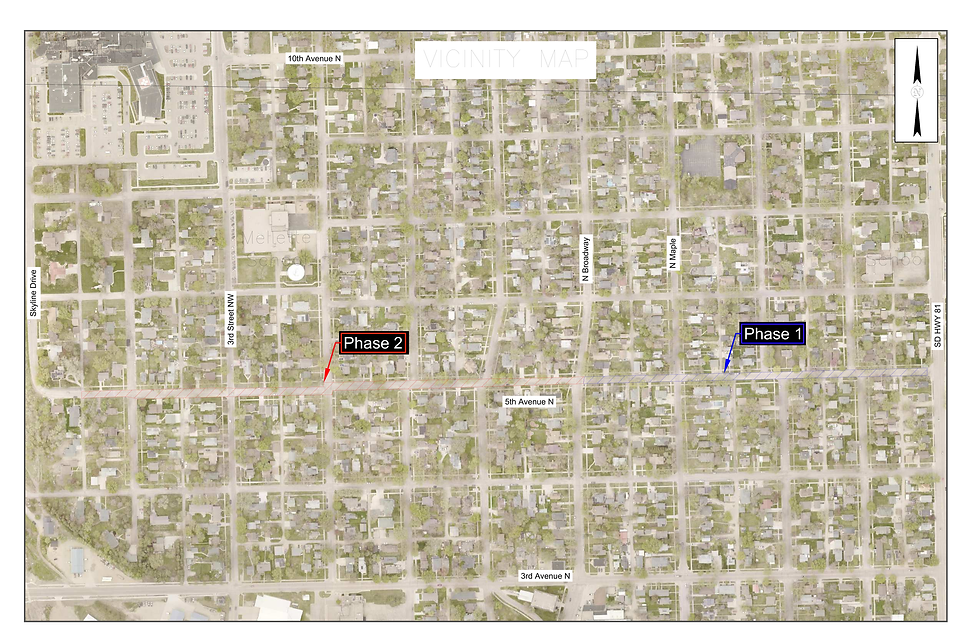 City map with highlighted zones labeled "Phase 1" in blue and "Phase 2" in red. Streets are named, showing an urban layout.