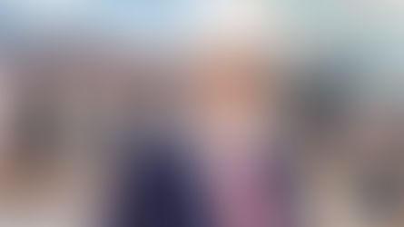 Man in a suit with a cowboy hat smiles in an urban setting. Text reads "Larry Rhoden for Governor." Logo for Northeast Radio SD.