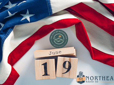 American flag backdrop with wooden blocks reading June 19 and City of Watertown, South Dakota seal beside Northeast Radio SD logo.