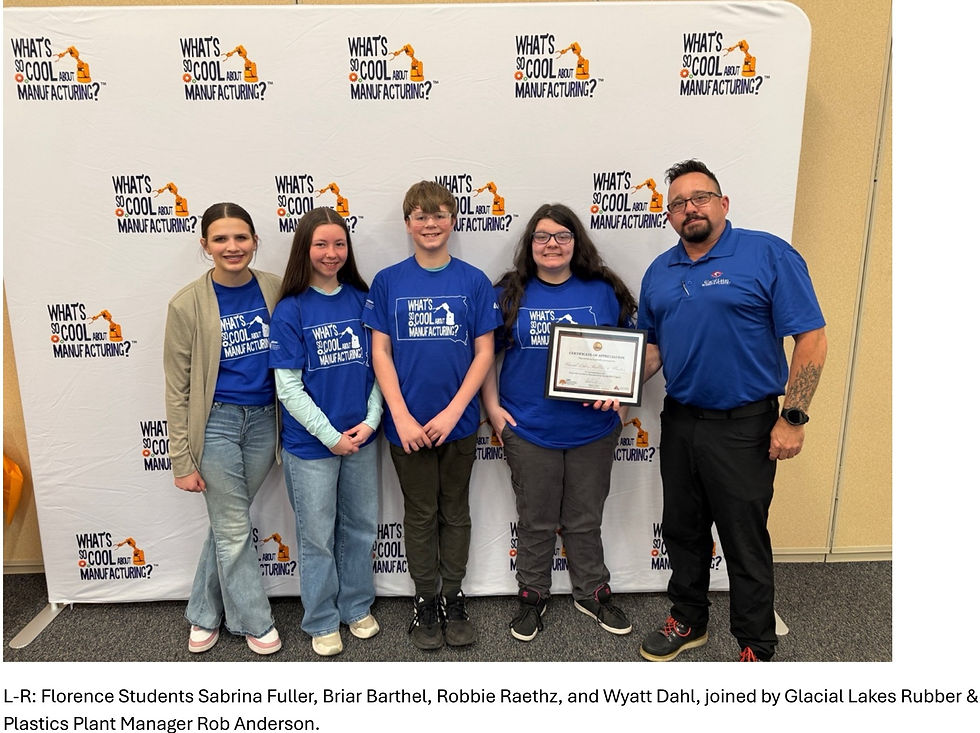 Four students and a man pose with a certificate before a What’s So Cool About Manufacturing? backdrop at an event.