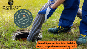 Worker wearing blue gloves handles hose into grassy ground. Logos for Northeast Radio SD and City of Watertown. Text: Council approves East Point replat.