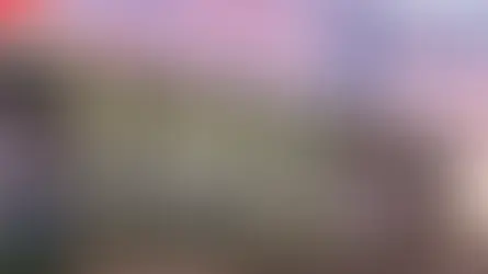 Exterior of Prairie Lakes Wellness Center at sunset, featuring large glass windows. "News Update" text visible, mood is calm and inviting.