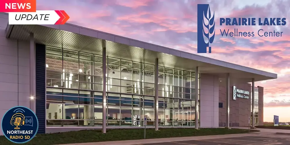 Exterior of Prairie Lakes Wellness Center at sunset, featuring large glass windows. "News Update" text visible, mood is calm and inviting.