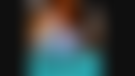 Man speaks into a mint microphone in a studio; orange-and-teal live-stream banner reads Northeast Radio SD and Seppanen Contracting.