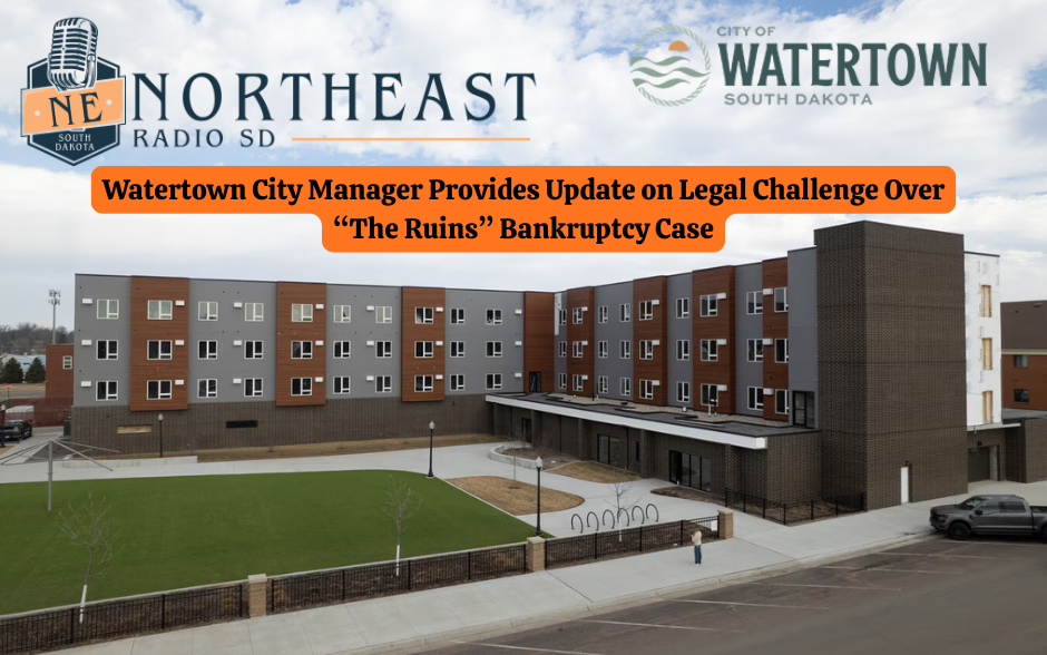 A modern multi-story building with green lawn, overlaid text: "Watertown City Manager Updates on 'The Ruins' Bankruptcy Case." Logos for Northeast Radio SD and City of Watertown SD.