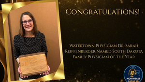 Smiling woman holds award plaque. Gold text reads: "Congratulations! Watertown Physician Dr. Sarah Reiffenberger Named South Dakota Family Physician of the Year."