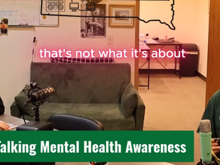 Two podcast hosts in a cozy studio discuss mental health awareness; Northeast Radio SD Community logo and text overlay.