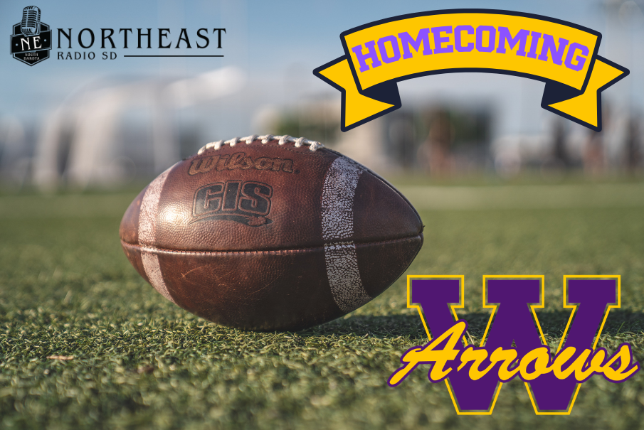 Football on turf with Homecoming banner, W Arrows text, and Northeast Radio SD logo against a blurred field.