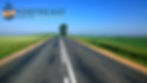 Empty rural road through green fields under blue sky, with Northeast Radio SD logo in the top left.