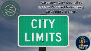 Green "City Limits" sign against cloudy sky. Text: "Watertown City Council to Review Plan for Modernizing City Limits Records." Two logos present.