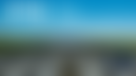 Runway view under clear sky with NTSB and "NORTHEAST Radio SD" logos overlayed. Green fields in the background.