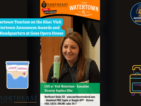 Woman speaking into a microphone during a live podcast about Watertown tourism. Text highlights awards and new HQ at Goss Opera House.