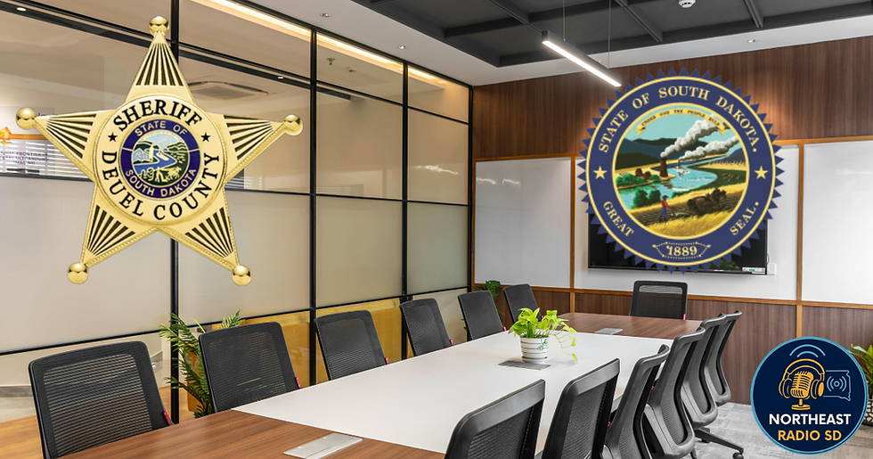 Conference room with a long table, chairs, and plants. Overlaid badge reads "Sheriff Deuel County." South Dakota seal and radio logo visible.