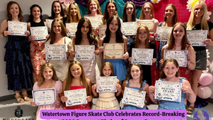 Watertown figure skaters pose with award certificates at a banquet under pink and purple decorations.