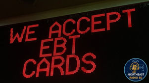 LED sign displaying "WE ACCEPT EBT CARDS" in red letters. A "NORTHEAST RADIO SD" logo is visible on the bottom right.
