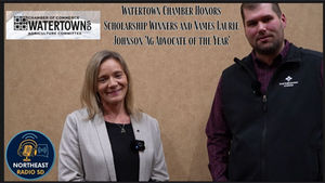 Two people stand smiling against a beige wall. Text: "Watertown Chamber honors Laurie Johnson 'Ag Advocate of the Year'." Northeast Radio SD logo visible.