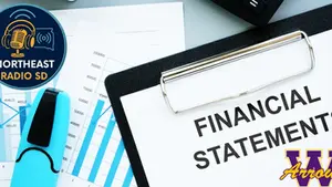 Clipboard with "Financial Statements" text, blue graphs, and a blue highlighter. "Northeast Radio SD" logo and "W Arrows" insignia visible.