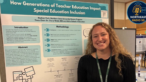 Smiling woman stands by a poster titled "How Generations of Teacher Education Impact Special Education Inclusion" at a conference.
