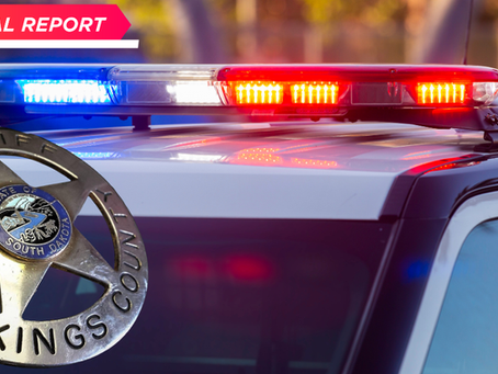 Sheriff's car with blue and red lights flashing. "Special Report" text in corner. Brookings County badge visible. Radio logo in corner.