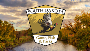 South Dakota Game, Fish & Parks logo with a pheasant in flight. Background features a serene river, autumn trees, and a cloudy sky.