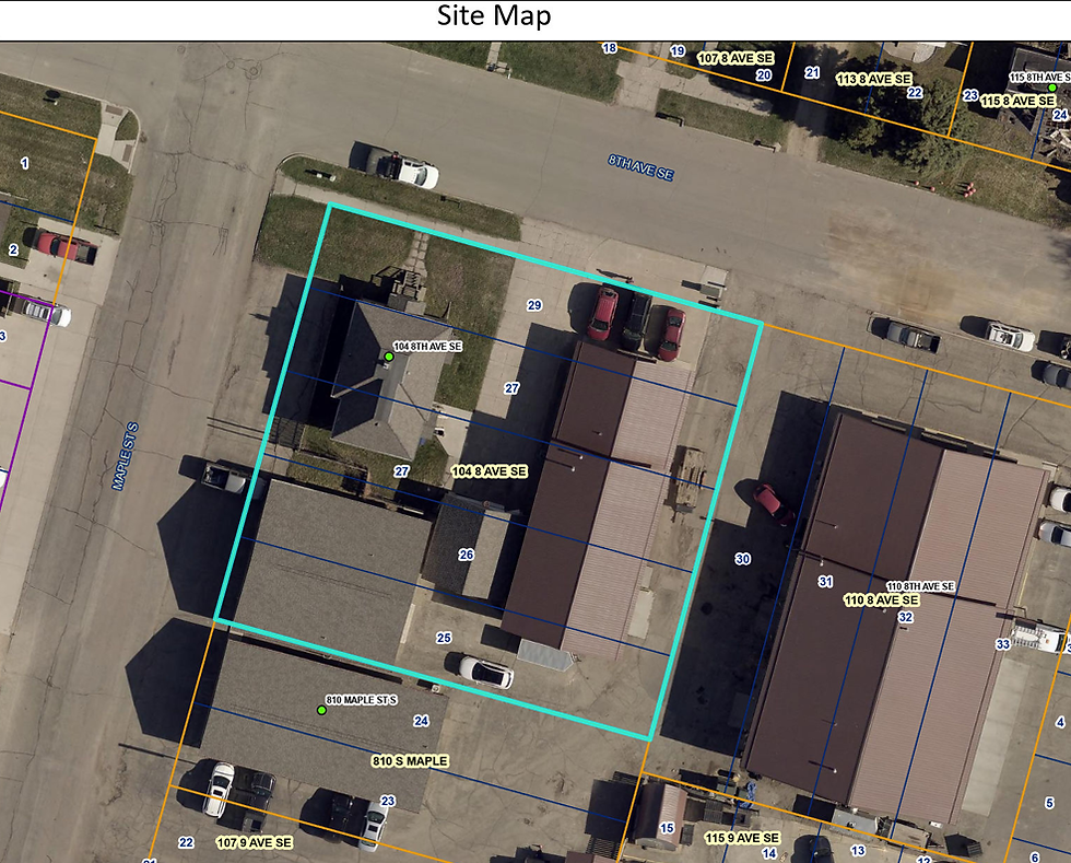 Aerial site map with a cyan outlined property at 104 8 Ave SE, showing buildings, parked cars, and nearby streets.