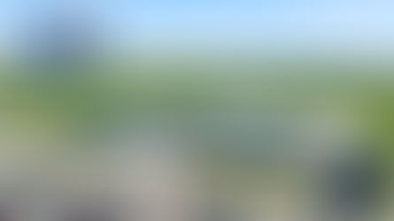 Aerial view of Watertown Regional Airport with parked cars, green fields, and clear skies. Text: "FLY ATY," "NORTHEAST RADIO SD."