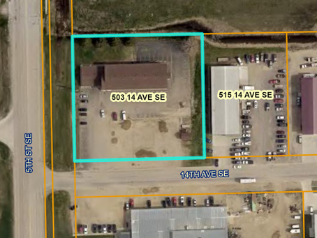 Aerial view of a commercial lot and buildings along 14th Ave SE and 5th St SE, with labels 503 14 AVE SE and 515 14 AVE SE.