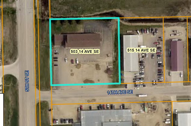 Aerial view of a commercial lot and buildings along 14th Ave SE and 5th St SE, with labels 503 14 AVE SE and 515 14 AVE SE.