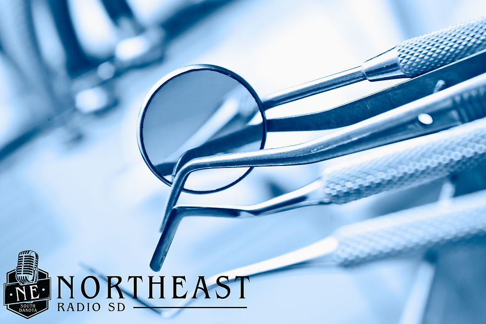 Close-up of blue-tinted dental tools and mirror, with Northeast Radio SD and NE South Dakota logo in the lower left.