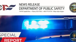 Blue police lights with "Special Report" text overlay. South Dakota Department of Public Safety seal and contact info visible above.