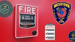 Red fire alarm on a wall with "FIRE" and "PULL DOWN." Watertown Fire Rescue and city logos, checklist with "PREVENTION" text.